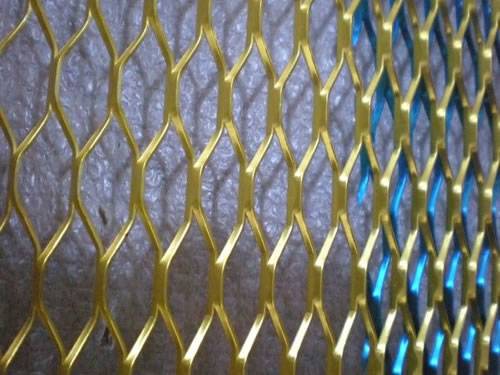 Golden aluminum expanded metal meshes with diamond holes are installed on interior wall.