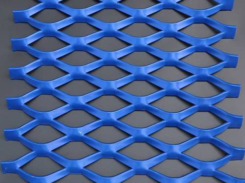 Green aluminum expanded metal meshes with diamond holes are installed on the architectural building facades by trellis.