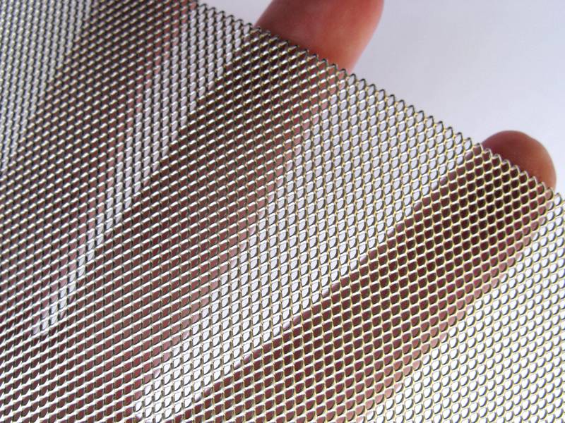 Green aluminum expanded metal meshes with diamond holes are installed on the architectural building facades by trellis.