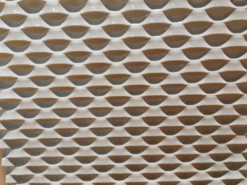 Golden aluminum expanded metal meshes with diamond holes are installed on interior wall.