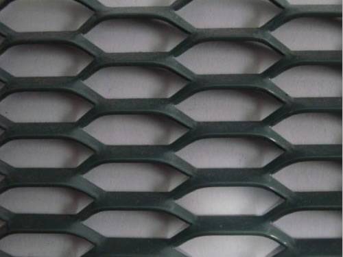 Green aluminum expanded metal meshes with diamond holes are installed on the architectural building facades by trellis.