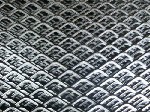 Green aluminum expanded metal meshes with diamond holes are installed on the architectural building facades by trellis.