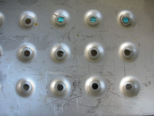 Green aluminum expanded metal meshes with diamond holes are installed on the architectural building facades by trellis.