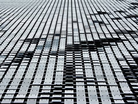 Golden aluminum expanded metal meshes with diamond holes are installed on interior wall.